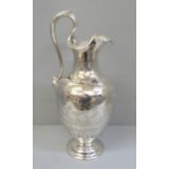 A Victorian Grecian revival silver claret jug, later engraved with chariots and palmettes, hinged