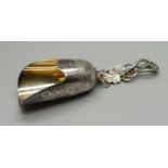 A small silver salt scoop with vine leaves handle, Birmingham 1970, 20g