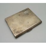 A silver cigarette case, Birmingham 1937, machine turned engraving with initials, 95g