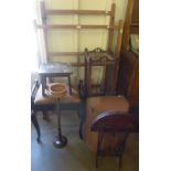 An Arts and Crafts oak jardiniere stand, an ebonised piano stool, two pine clothes airers, etc.