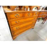 A yew wood chest of drawers