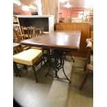 A Singer mahogany and cast iron based pub table