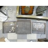 Five vintage printed trays, including sets of brass letters