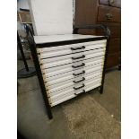 Two black tubular metal and white laminate plan chests