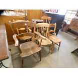 Six assorted Victorian kitchen chairs and a stool