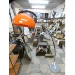 A vintage chrome and orange glass floor standing arc lamp