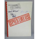 A Spies Like Us film promo book autographed by Chevy Chase and Dan Aykroyd