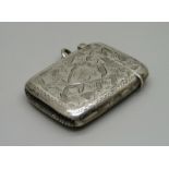 A silver vesta case