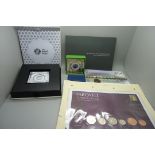 Coins and coin covers; four coin covers along with Royal Mint presentation folders housing