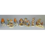 Nine Goebel/Hummel figures, Apple Tree Girl, Carol Singer, Boy With Lamb, etc., some a/f