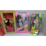 A Winter Splendour Barbie, an Austin Powers Dr. Evil doll and a Barbie Bead Blast, boxed