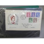 Stamps; Queen Elizabeth II with first day covers and postal history (1953-1969) in album (46 items)