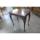 A George II carved mahogany side table