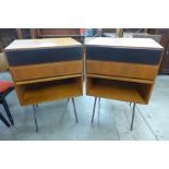 A pair of Danish teak cabinets on black metal stands