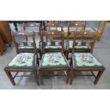 A set of six Regency carved mahogany dining chairs