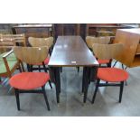 A G-Plan Librenza tola wood and black drop leaf table and four butterfly-back chairs