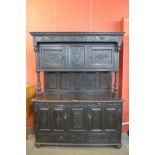 A 17th Century style Welsh carved oak cwpwrdd deuddarn