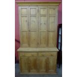 A Victorian waxed pine housekeepers cupboard