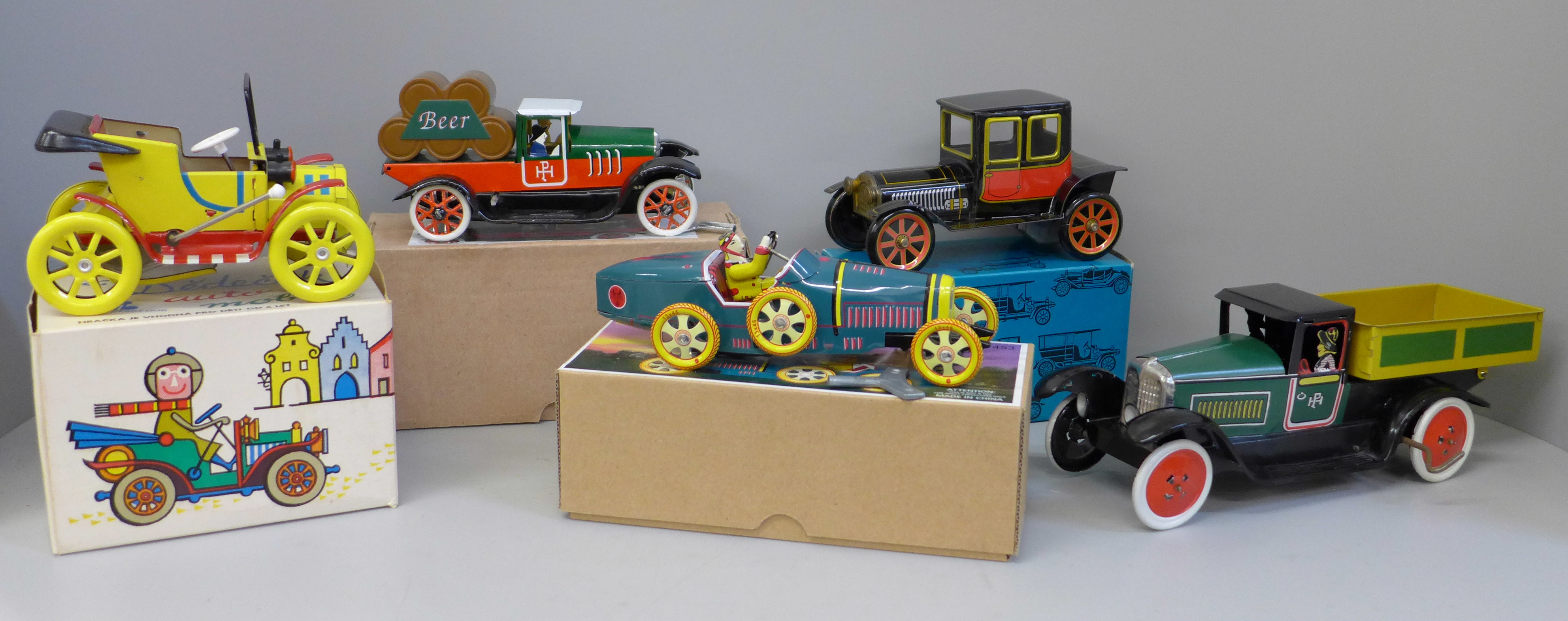 A collection of tin plate toys