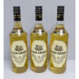 Three bottles of Glen Grant Highland Malt Scotch Whisky