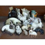 A collection of cat figures including three Royal Doulton Siamese, Imari, a cream jug, Sylvac and