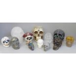A box of crystal skulls, resin skulls and others, twelve in total