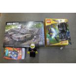 A Call of Duty Mega Blocks set, Lego Batman movie outfit and Lego torch, Dr. Who items, etc.