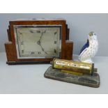 A walnut mantel clock, W.H. May, Nottingham, a small desk perpetual calendar and a Fairy Penguin