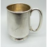 A silver mug, with inscription, 65g