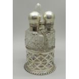 A silver mounted trio of scent bottles in stand, Birmingham 1906