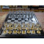 A drinking chess set, two glasses a/f