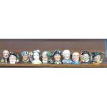Ten Royal Doulton character jugs including Henry Cooper, Prince Albert and Queen Victoria