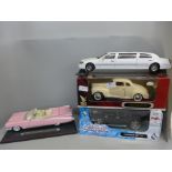 Four 1/18th scale model vehicles, Maisto Hummer SUV, Signature 1941 Plymouth, Maisto Pink Cadillac