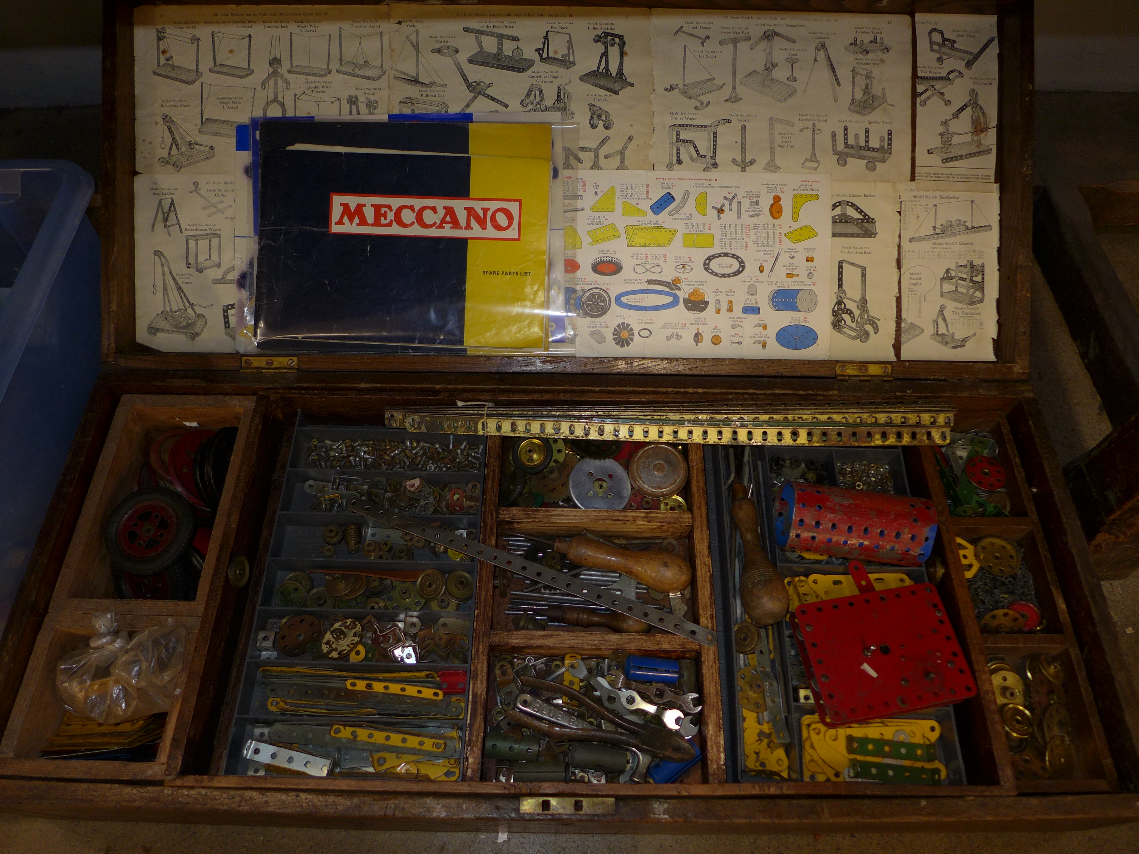 A large collection of Meccano in a wooden chest