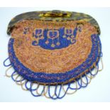 A vintage 1920s-50s beadwork purse with faux tortoiseshell clip