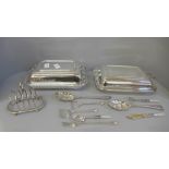 Two silver plated serving dishes, a silver plated toast rack, two berry spoons, etc.
