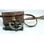 An antique clinometer, Barker & Son, London, Mk.IV, No. 6003, 1917, in a leather case marked Jacob's