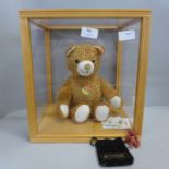 A Steiff Cosy Friends bear in display box and a miniature metal bear