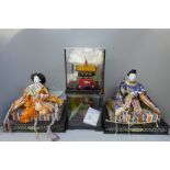 Three Japanese figures; two Geisha, a Samurai plus a ceremonial wagon