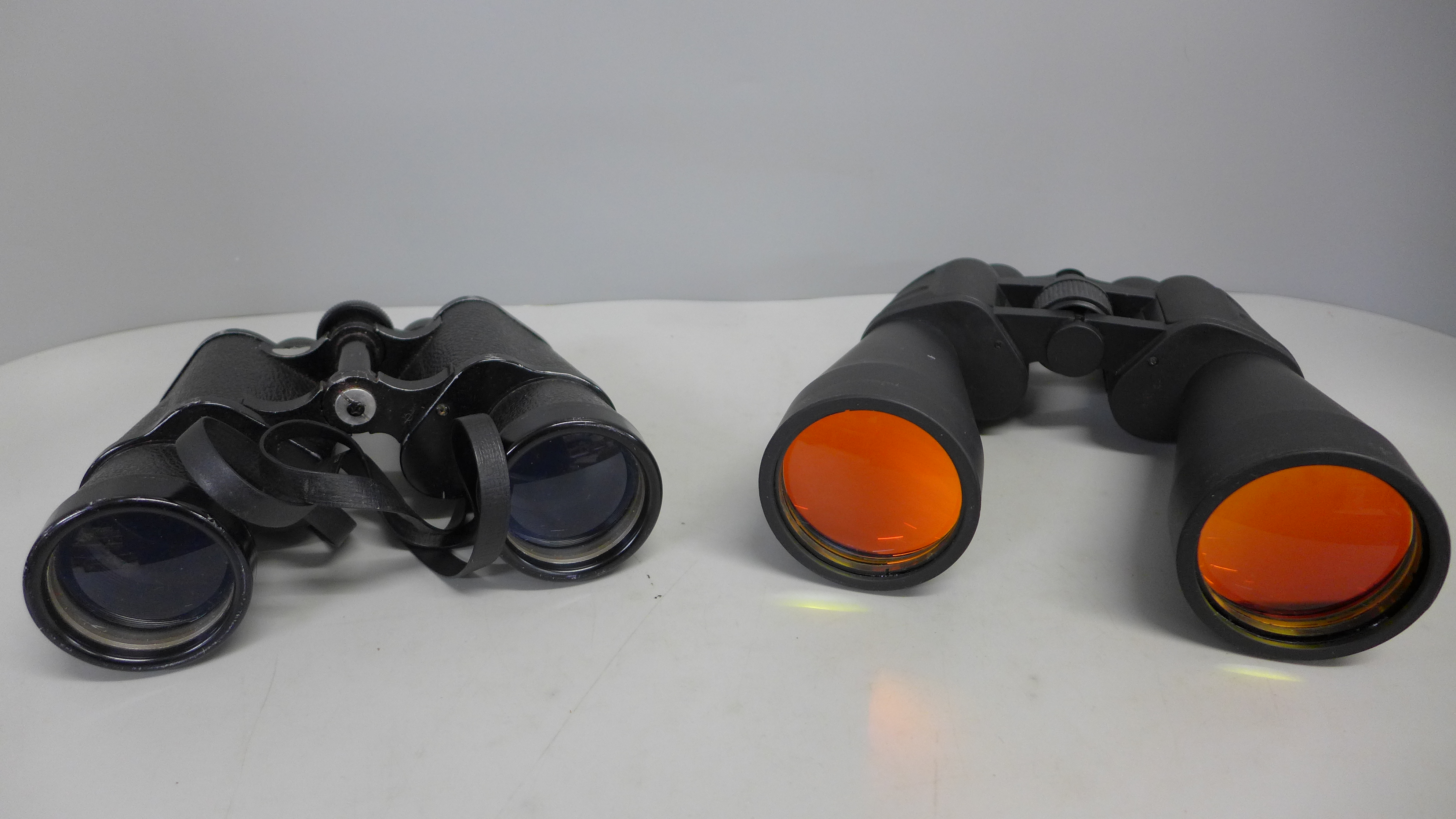 Two pairs of binoculars, Super Zenith 10x50 and one other