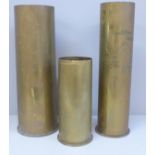 Three brass shell case vases, one with trench art mountain detail