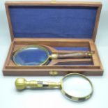 Two magnifying glasses, one cased