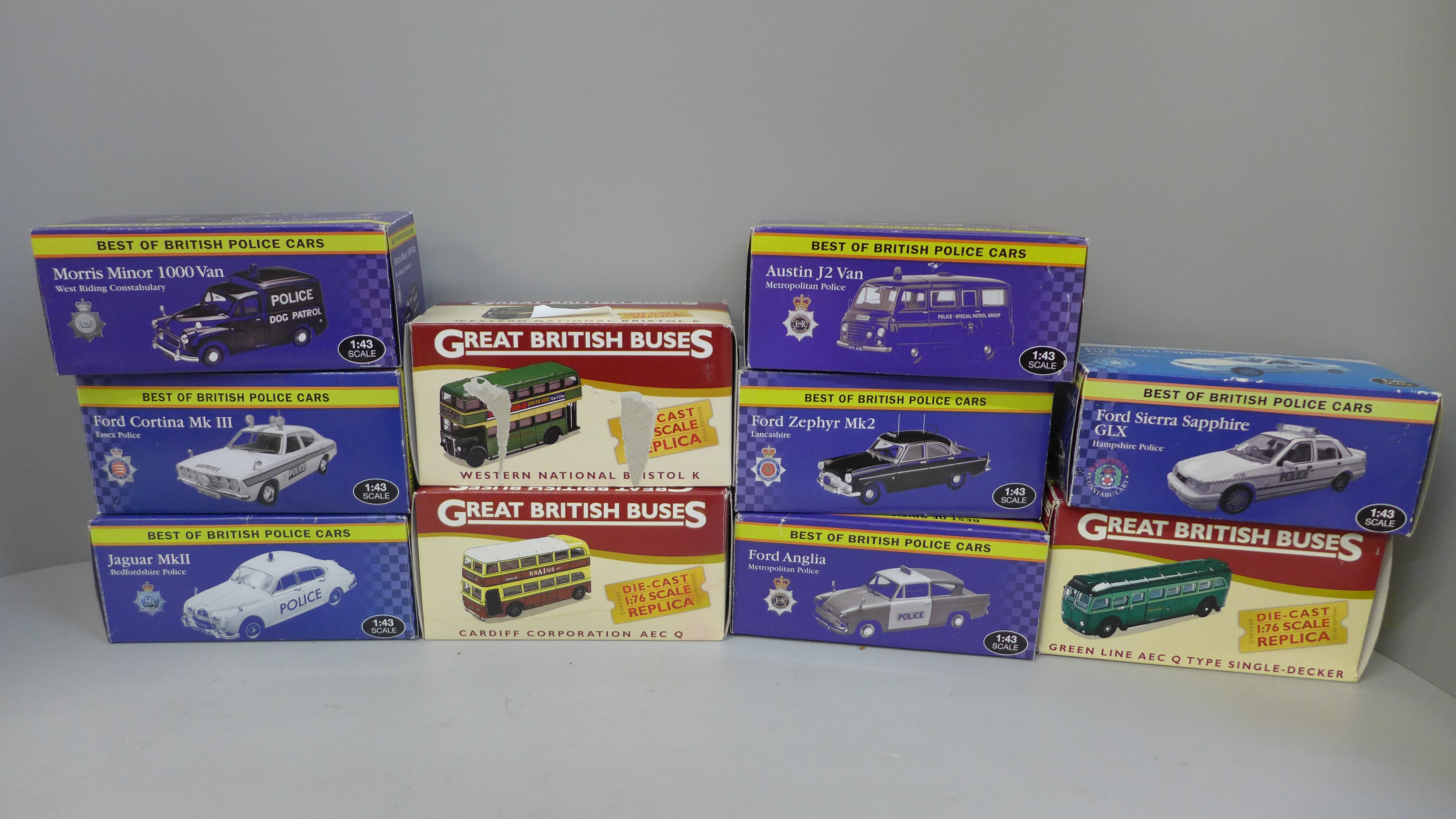 Three Atlas Editions 1:76 scale replica model buses, boxed and seven Best of British Police cars,