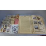 A German photo-sticker album, a collection of cigarette cards, a Silver Jubilee commemorative