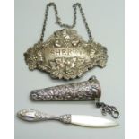 A silver Sherry label, a Victorian silver holder, Birmingham 1888 and a mother of pearl knife/letter