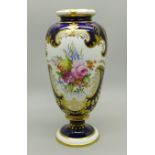 A small Royal Crown Derby vase, cobalt blue ground with gilding and two panels of a bouquet of