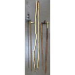 Two wooden staffs, three walking sticks and a fencing sword