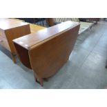 A Jentique teak drop leaf table