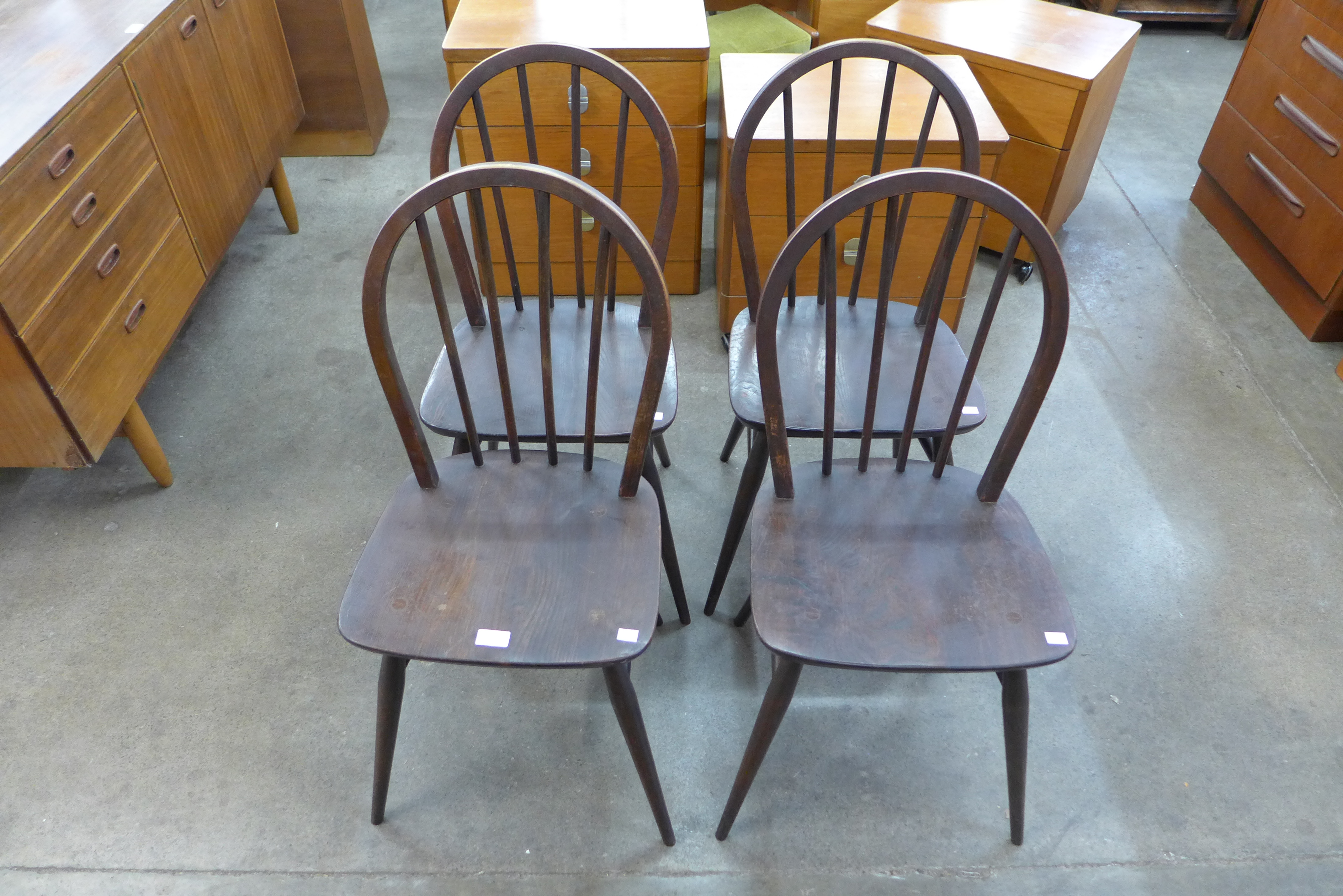 A set of four Ercol dark elm and beech Windsor chairs