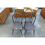 A set of four Ercol dark elm and beech Windsor chairs